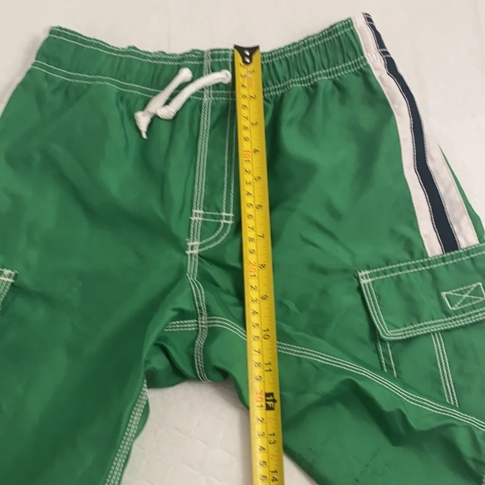 Old Navy green and white swim trunks with pockets